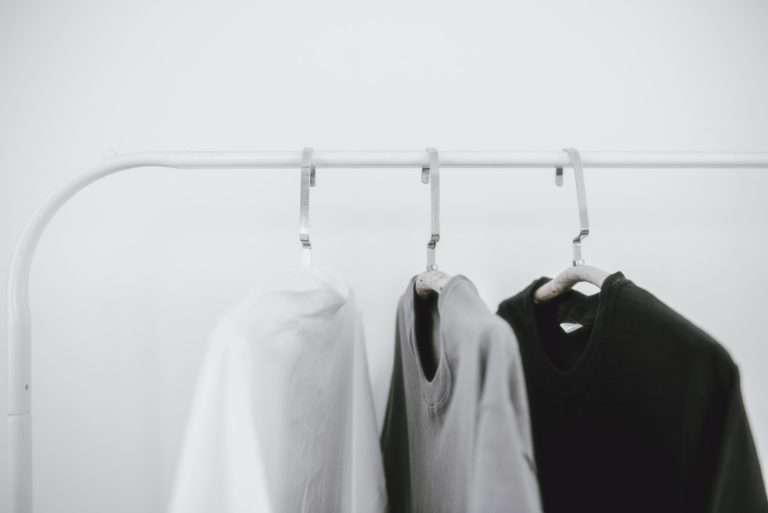 Minimal lifestyle, clothing rack with simple t-shirts